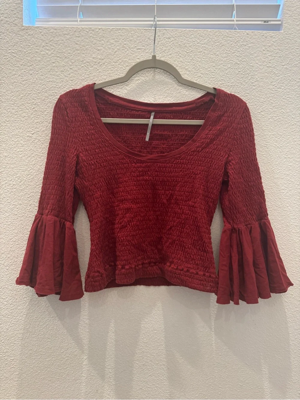 Anthropologie smocked bell-sleeve top with a scoop neckline & textured shirring